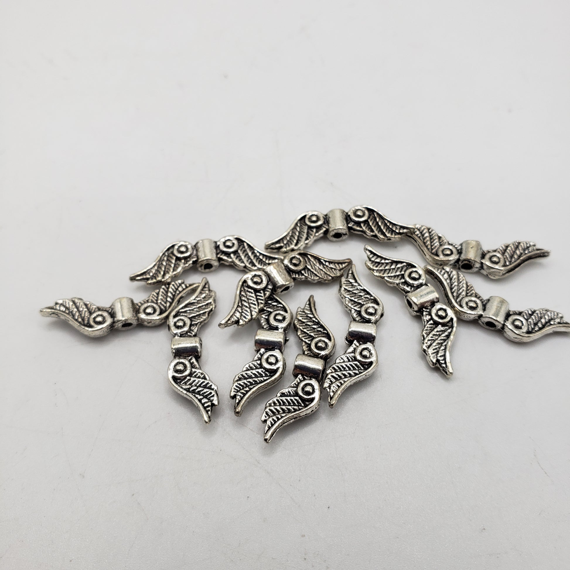 Pewter Wing Beads.